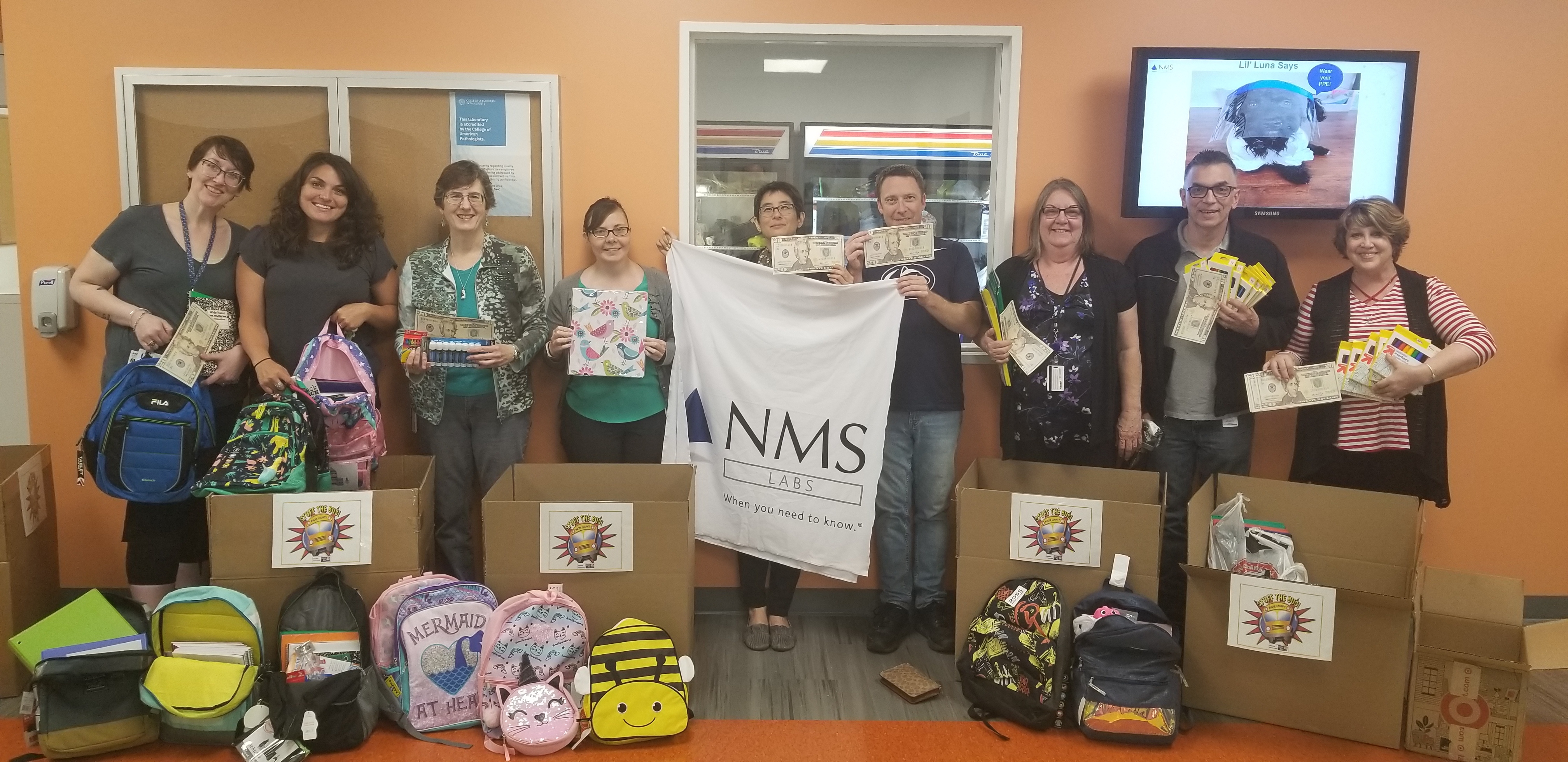 NMS Labs Stuffs the Bus for Charity